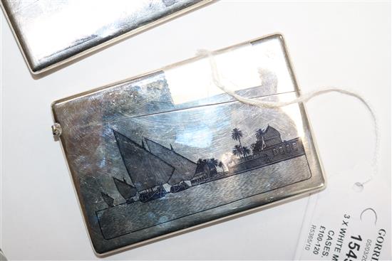 Two continental white metal and niello card cases and a similar cigarette case.